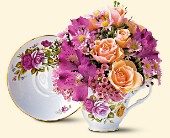 Tea cup arrangement with fresh flowers