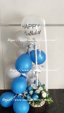 Blue silver balloons arrangement with roses and happy birthday balloon