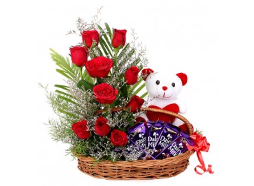 12 red roses 6 inch Teddy 5 dairy milk all in a basket